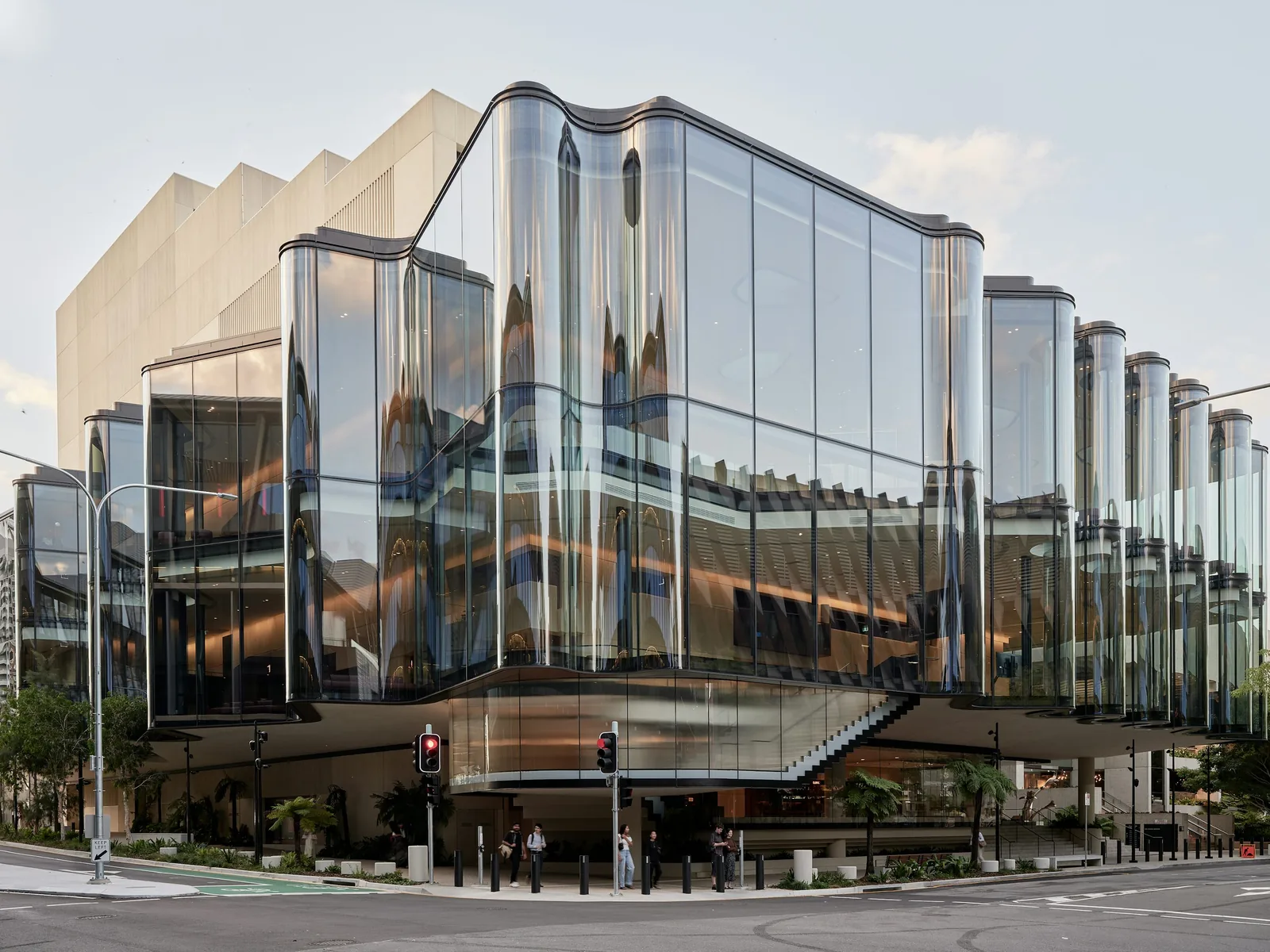 Illustrative modern commercial building with curved glass facade
