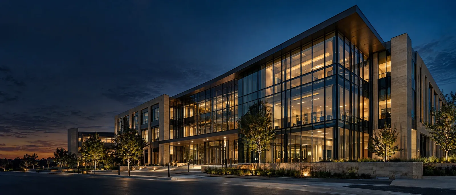 Illustrative modern commercial office building at dusk